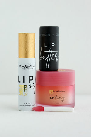 Set of lip care products including a balm, oil, and therapy product on a white background