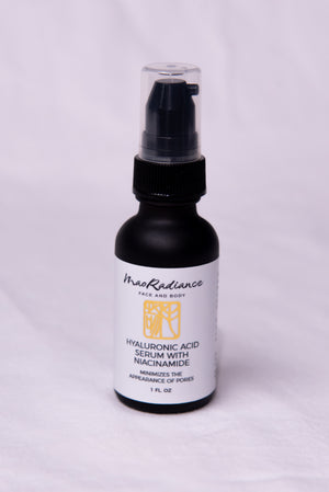 Skincare serum bottle with black cap and white label on a light gray background