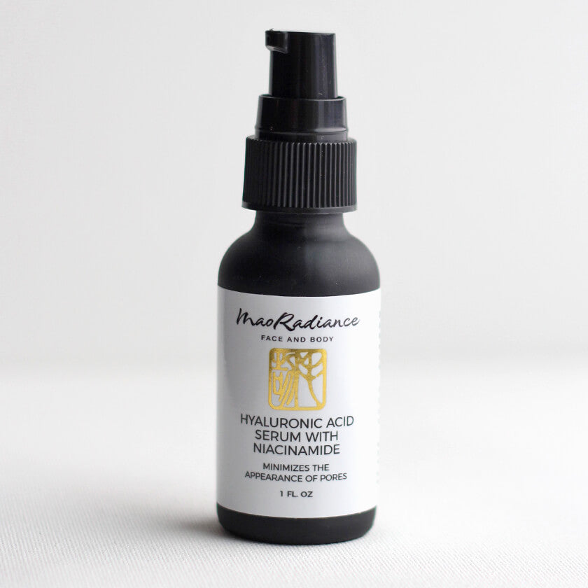 Black bottle of MaoRadiance Hyaluronic Acid Serum with Niacinamide on a white background