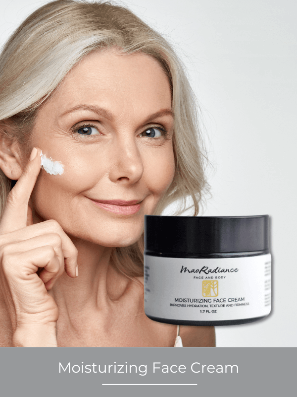 Woman applying moisturizing face cream with a jar of the product next to her.