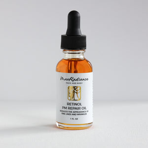 Bottle of Retinol PM Repair Oil with dropper on a white background