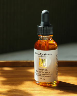 Bottle of MaoRadiance Retinol PM Repair Oil on a wooden surface with a dark background